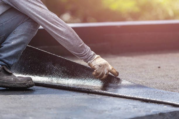 Professional Basement Waterproofing technician working in Toledo, IL